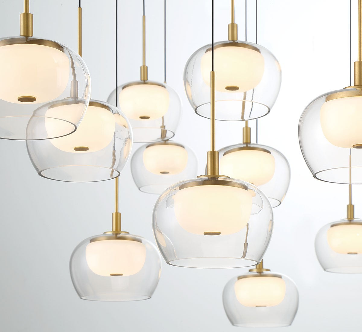 Lib & Co. Manarola LED chandelier featuring modern lighting design with sleek, contemporary pendant lights against a neutral background.