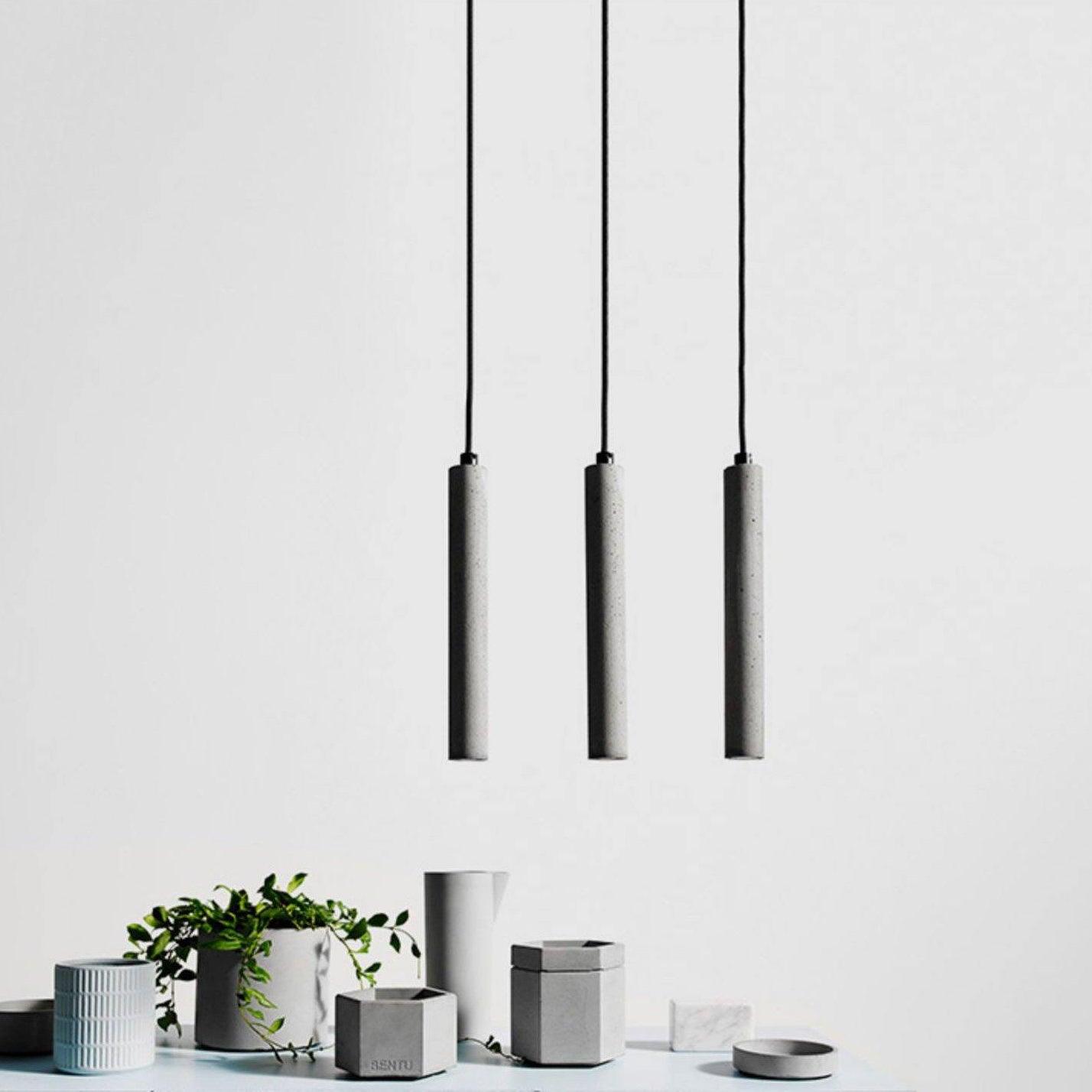 Vakkerlight Bang concrete pendant light hanging from ceiling with a sleek, modern design and exposed concrete finish.